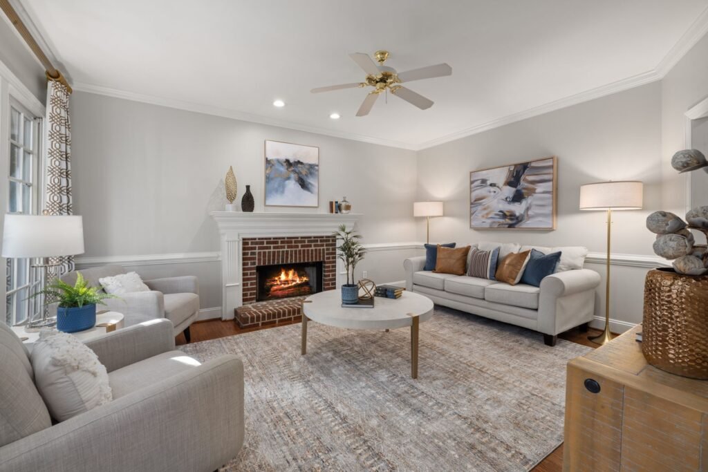 A refreshed living room with a tray on the coffee table, a storage basket, and warm lighting